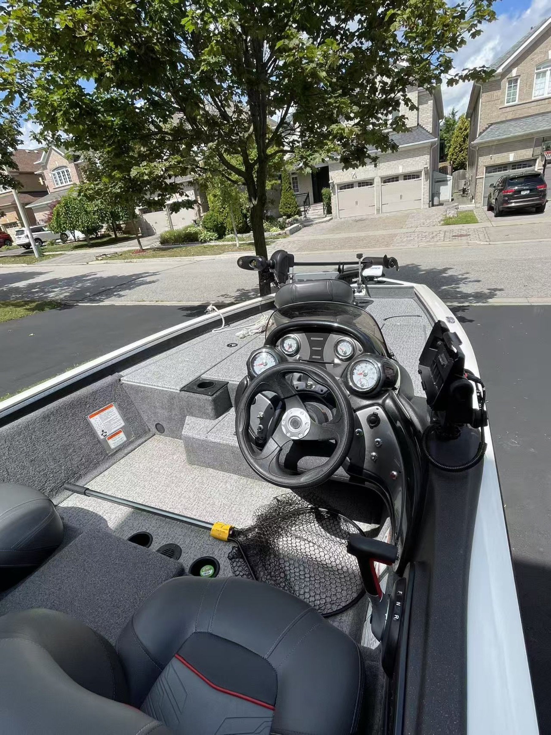 Cockpit console with steering wheel, gauges and Garmin fishfinder